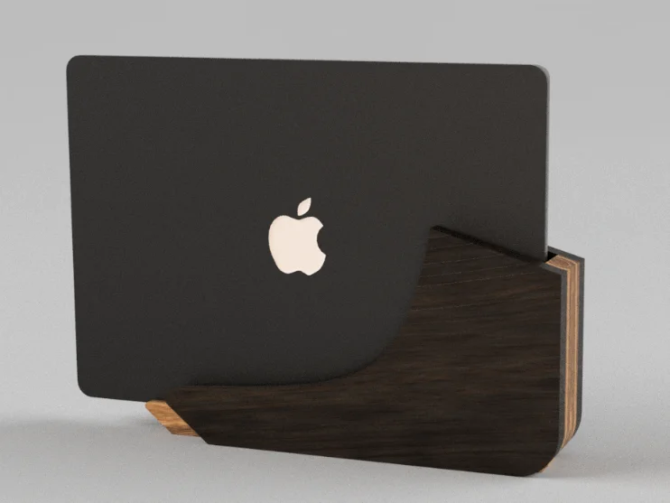 A closed MacBook Air seated in the hardwood dock