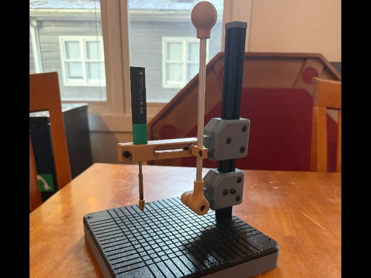 The finished modular vertical press on a workbench