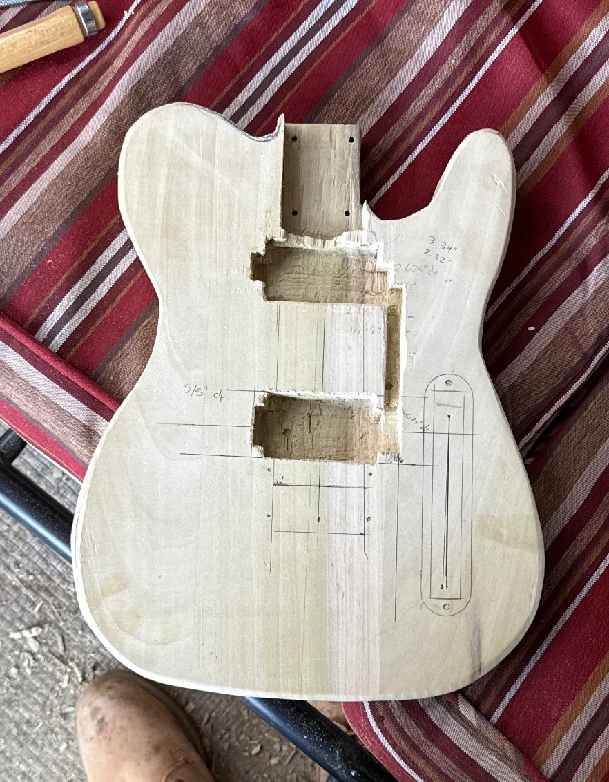 The routed poplar body blank with pickup and control cavities cut by hand